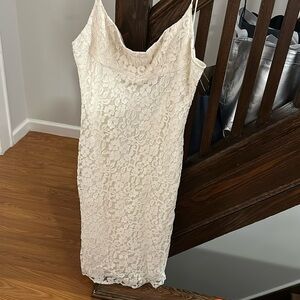 Off white Lace Body fit midi dress.